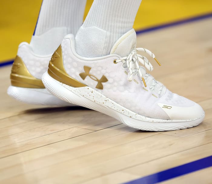 White and Gold Curry 1 shoes.